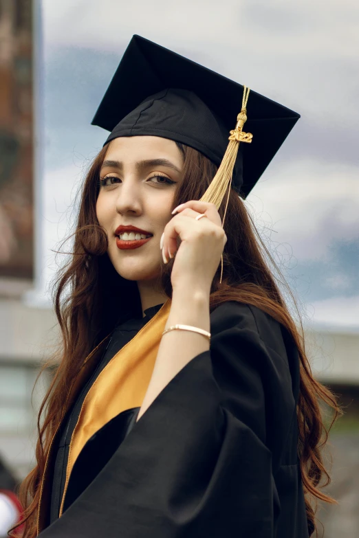 a female graduate talking on a cell phone