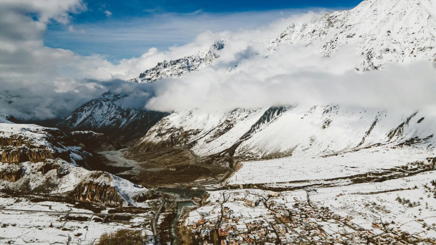 a snowy mountain in the middle of the day