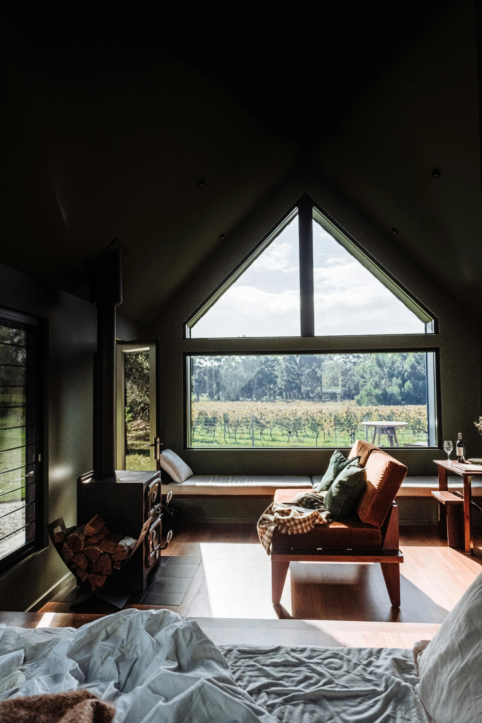 a bedroom that has a large window in it