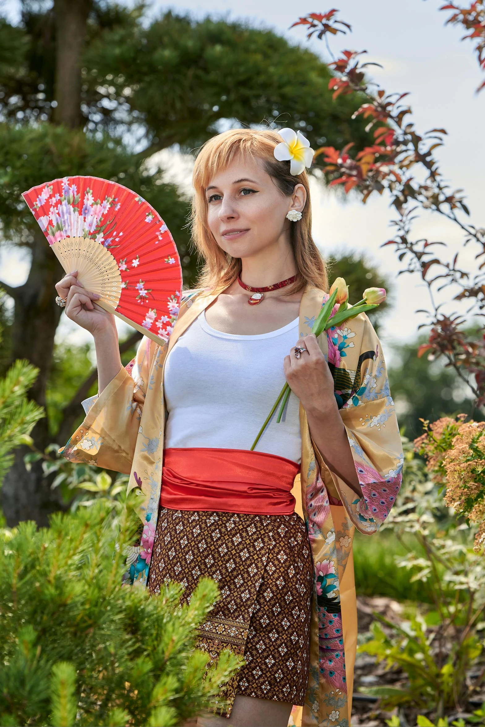 a woman with an oriental umbrella in her hand