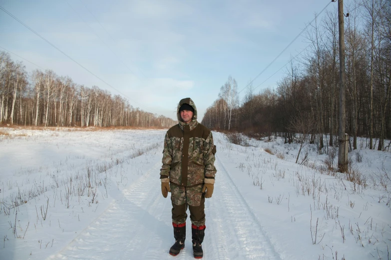 a man is walking in the snow on a pair of skis