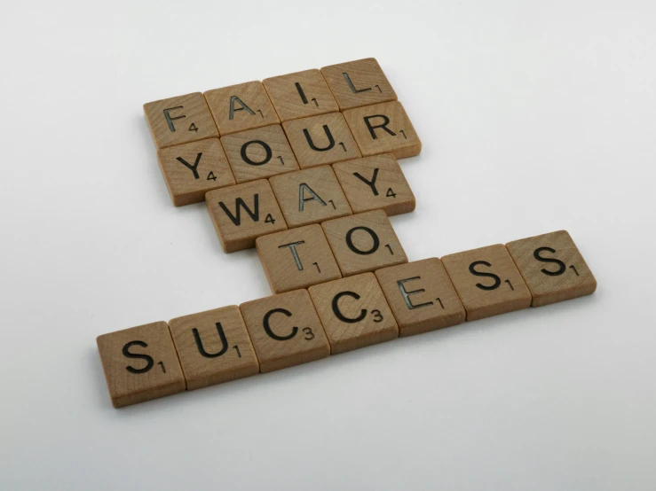 a scrabbled po of the words fail your way, to success and failure