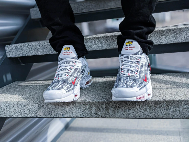 man in sneakers with sneakers on them on stairs