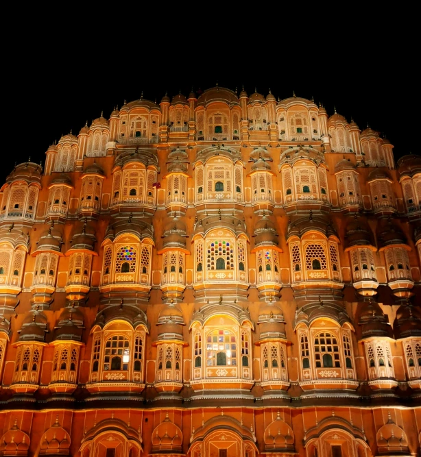 an ornate building lit up at night