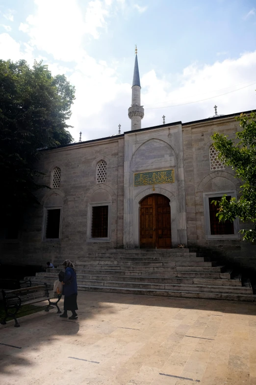 a building with some steps leading to a dome