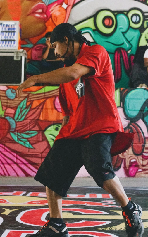 a young man doing an acrobatic stance on his skateboard