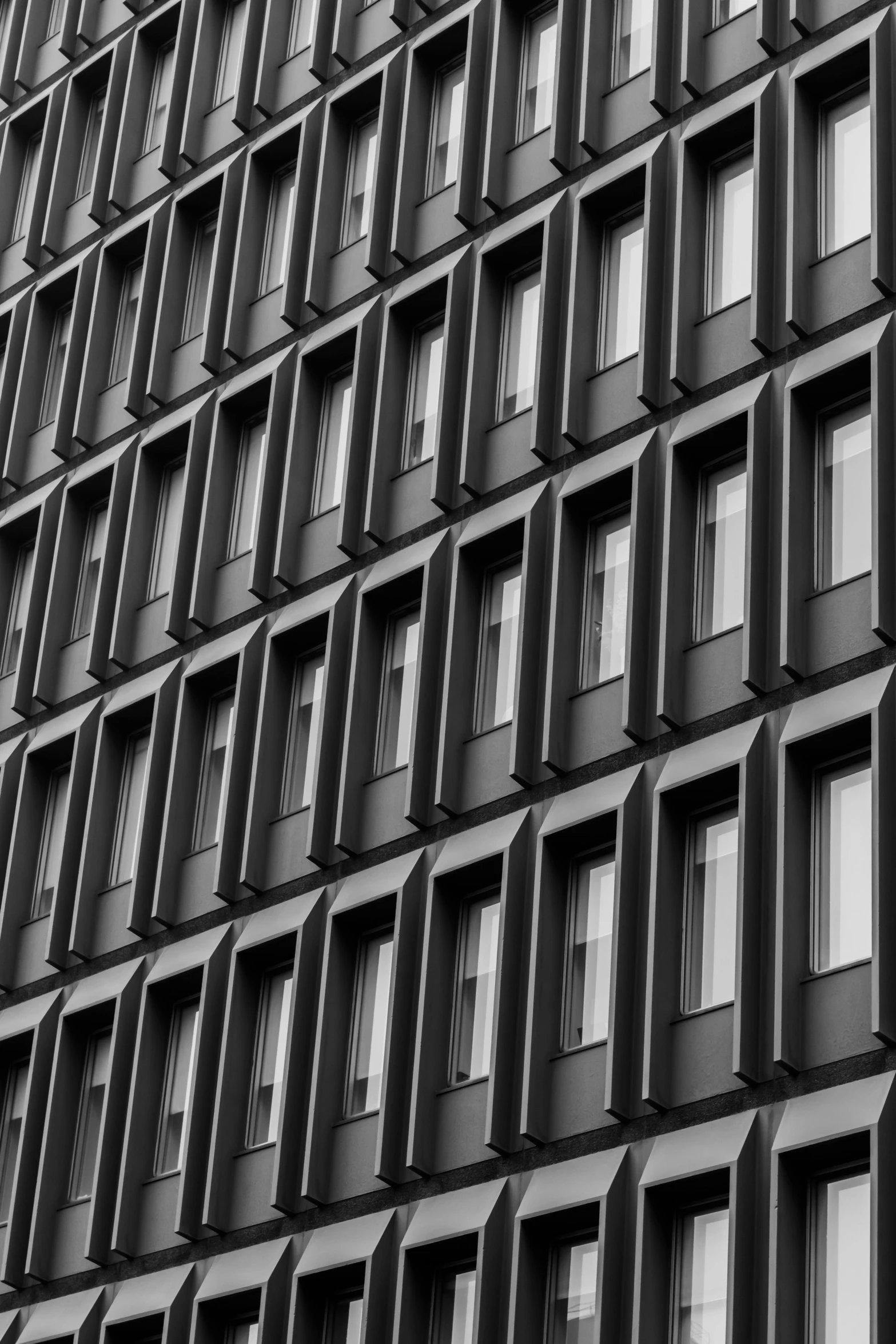 an architectural view of a dark building facade