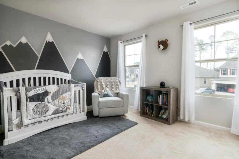 a bedroom decorated in grey, white and yellow