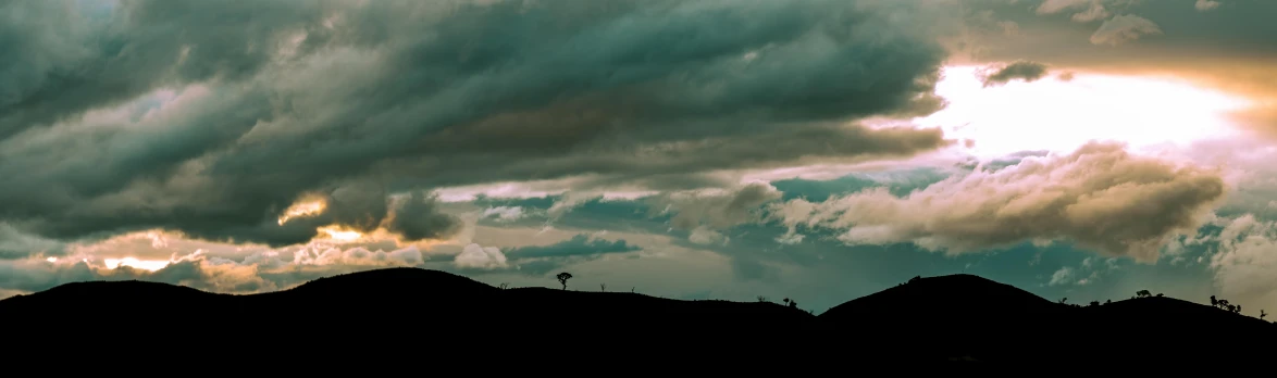 a airplane in flight next to some mountains