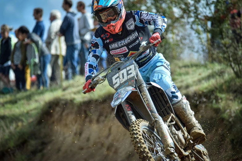 a person riding a dirt bike on a track