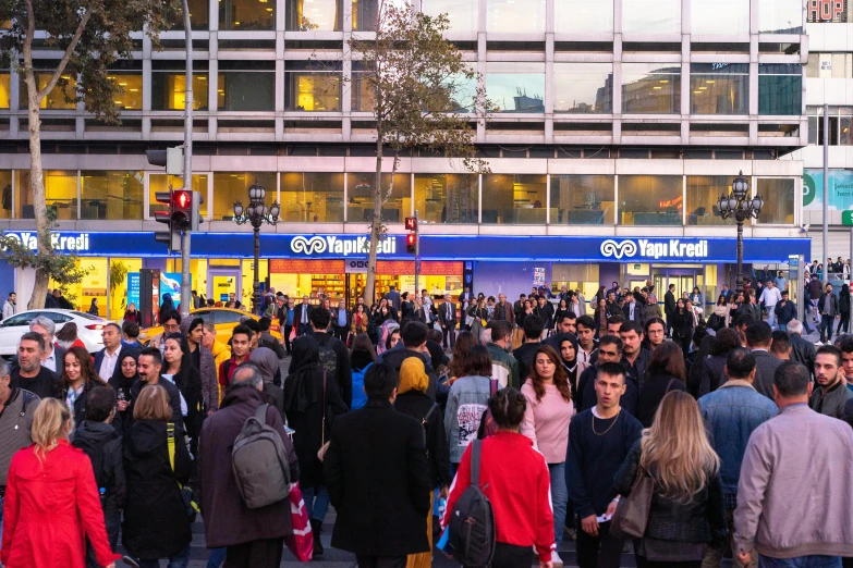 people walking in front of a busy shopping district