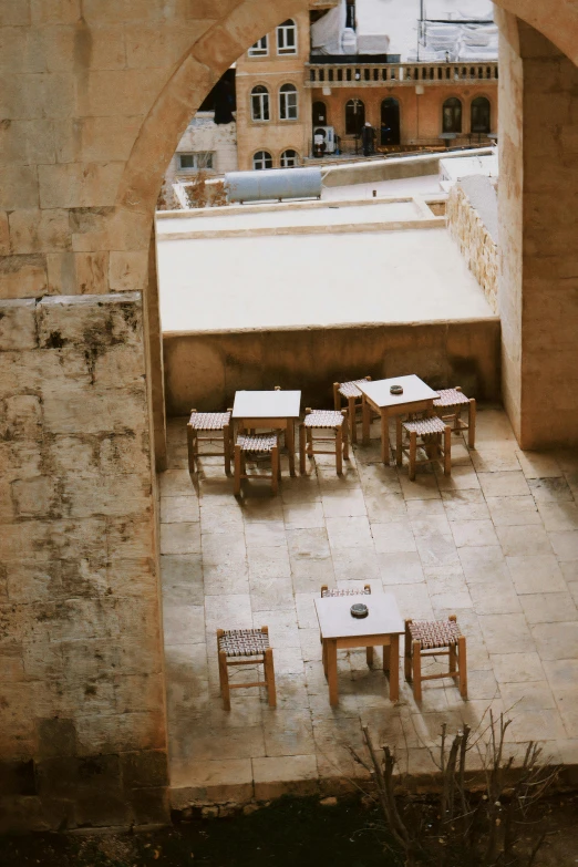 an outdoor seating area with chairs and tables