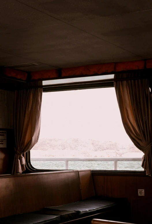 the inside of a cabin looking out the window