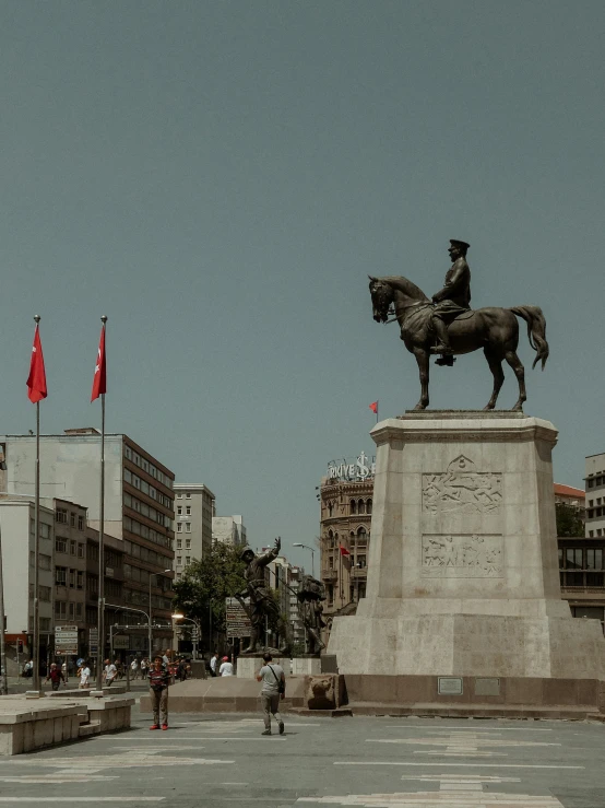 a statue of a man riding a horse on top of a pedestal