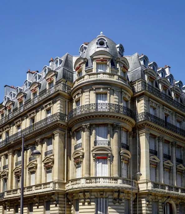 an ornate building with many balconies on the top of it