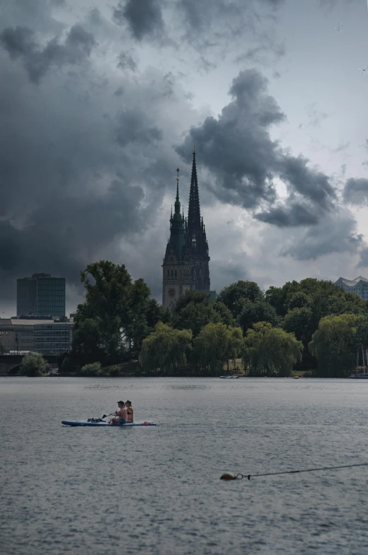 a man and a woman in a canoe on the water