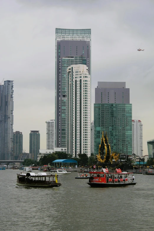 a harbor filled with lots of boats and large tall buildings