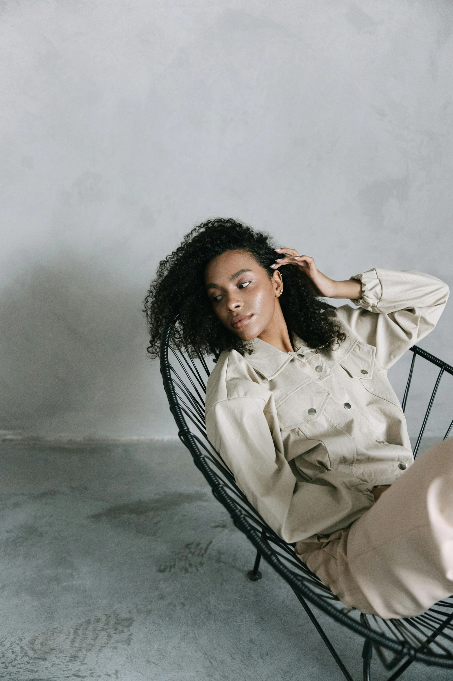 a woman wearing pajamas and sitting on top of a chair