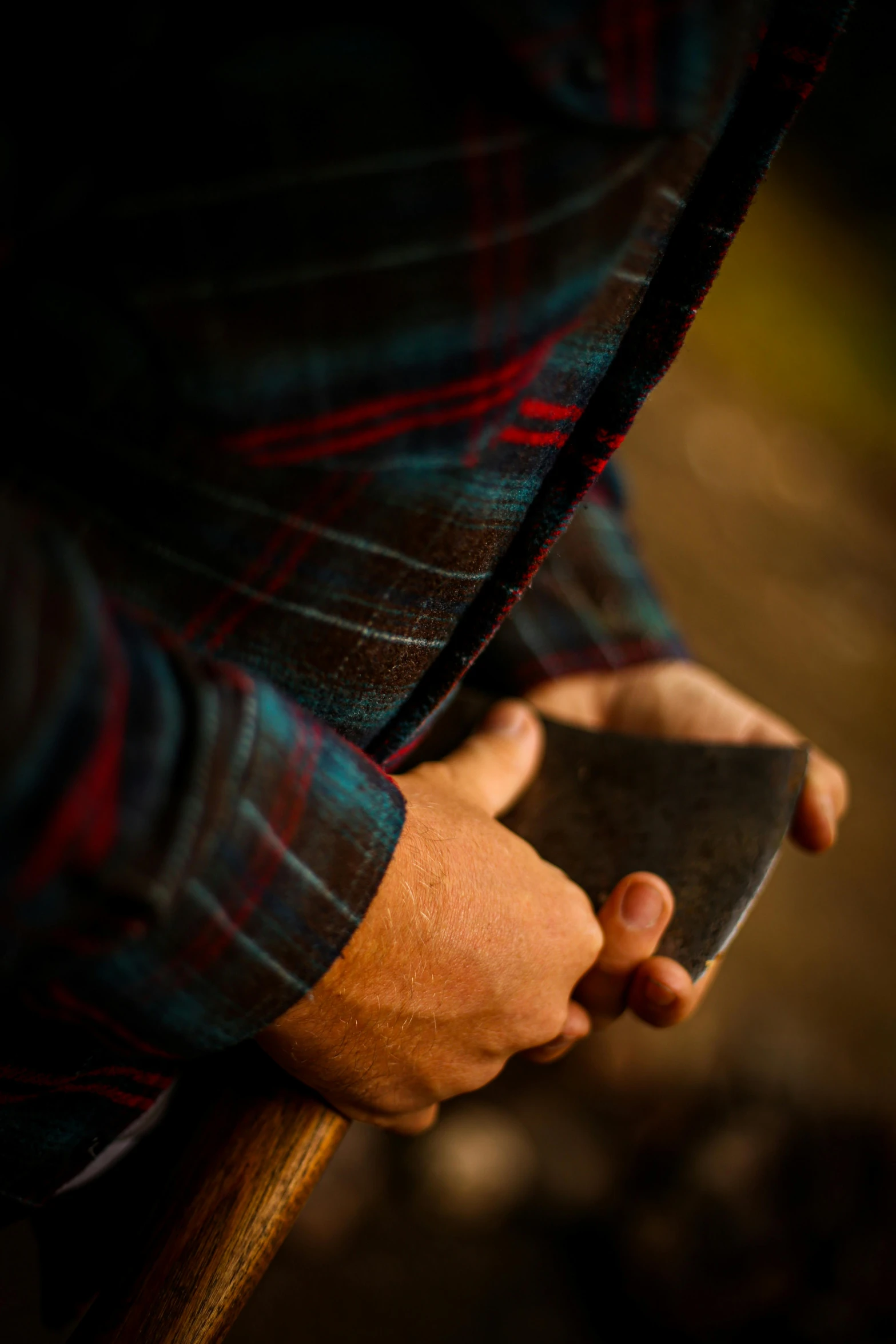 a man holding a metal object in his hand