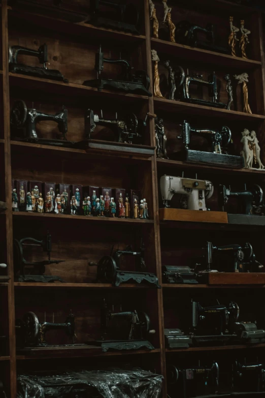 rows of shelves of antique sewing devices on display