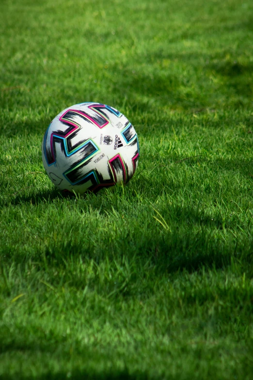 a soccer ball is shown laying in the grass