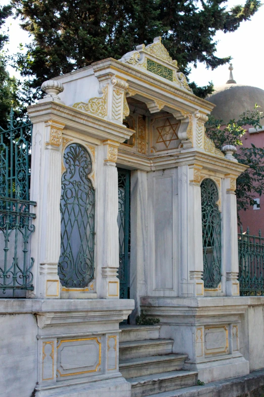 a large white monument near some steps