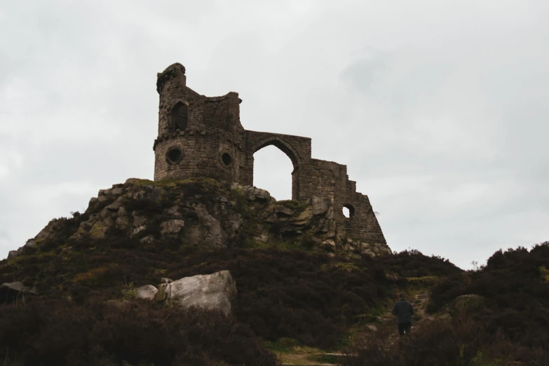 a castle with a person standing on the side