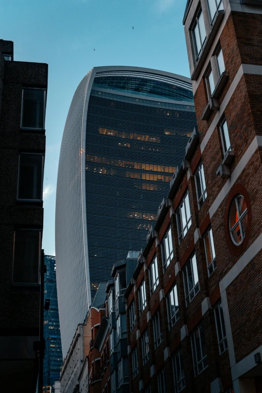 view looking up into a city at a tall building