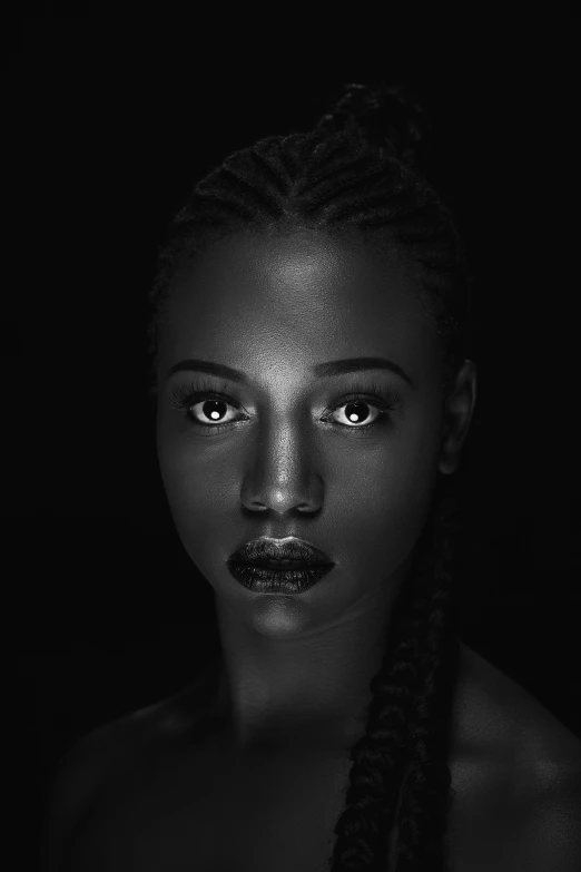 a woman with ids standing in front of a black background