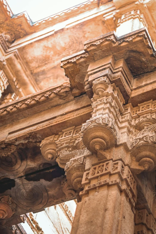 old pillars are pictured in front of a crumbling building