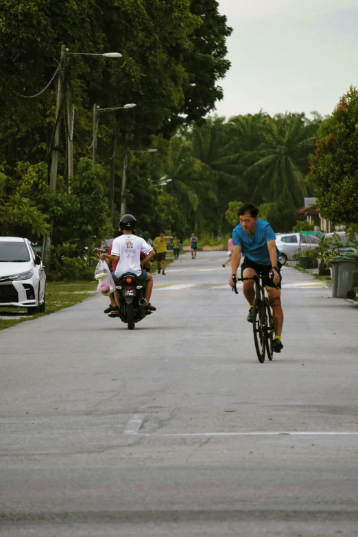 men on motorcycles are riding down the street