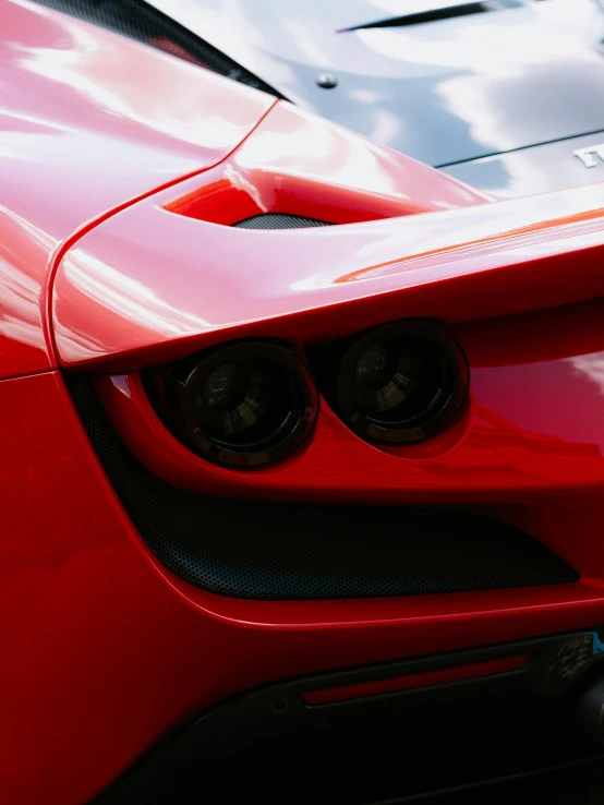 the front lights on a red sports car