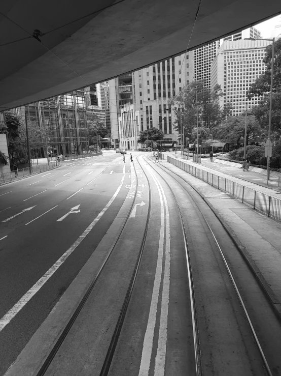 some city buildings buildings and a train track