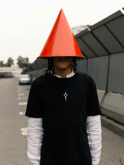 the person has a cone on their head