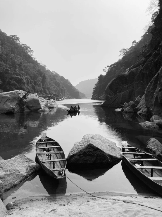 boats on the lake in a black and white scene