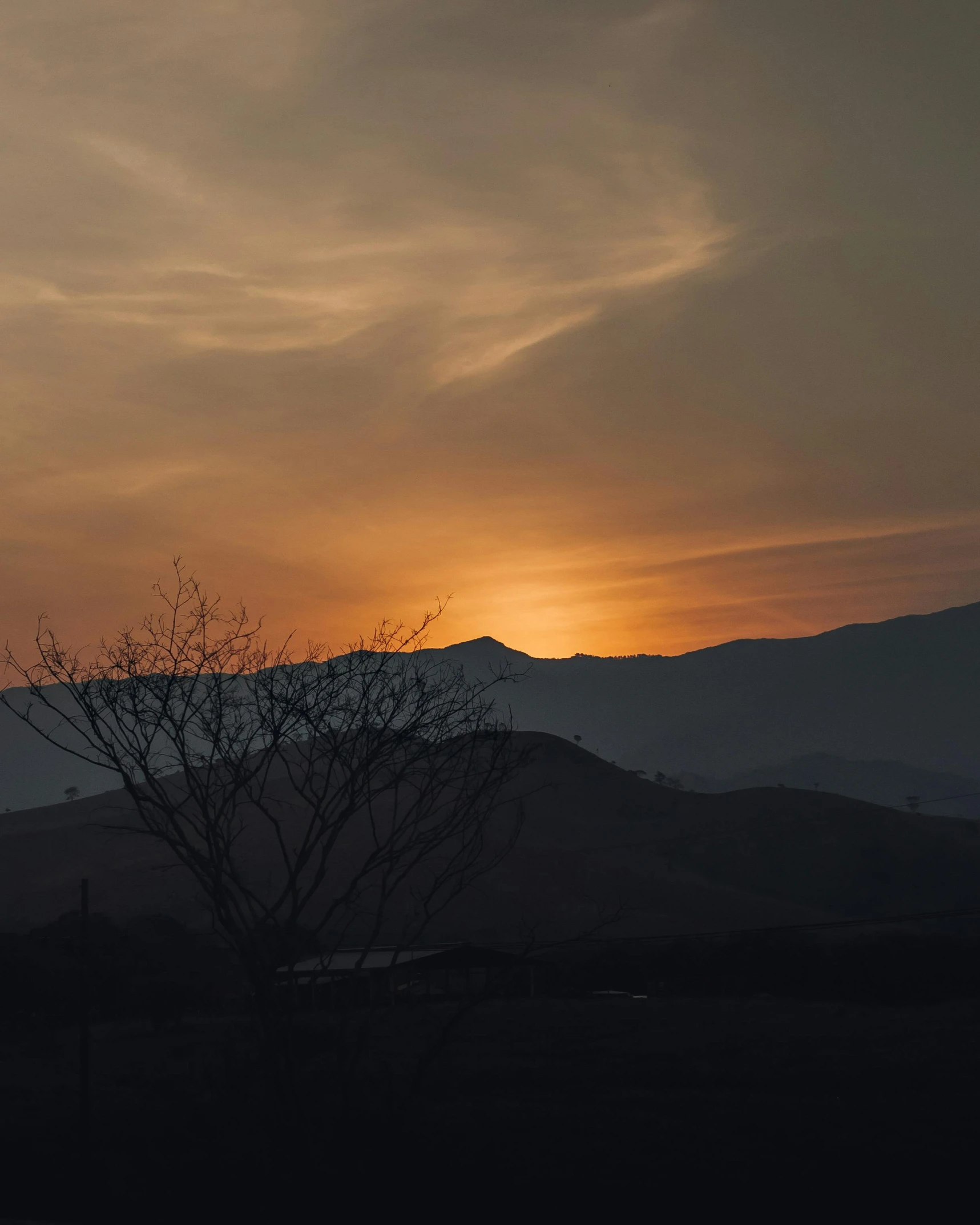 a sky with some very large mountains in the background