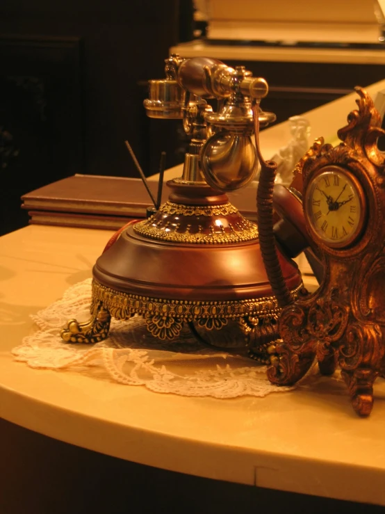 an antique coffeemaker is sitting on a marble counter