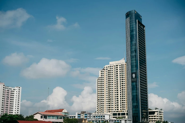 a very tall building that is in the middle of some clouds