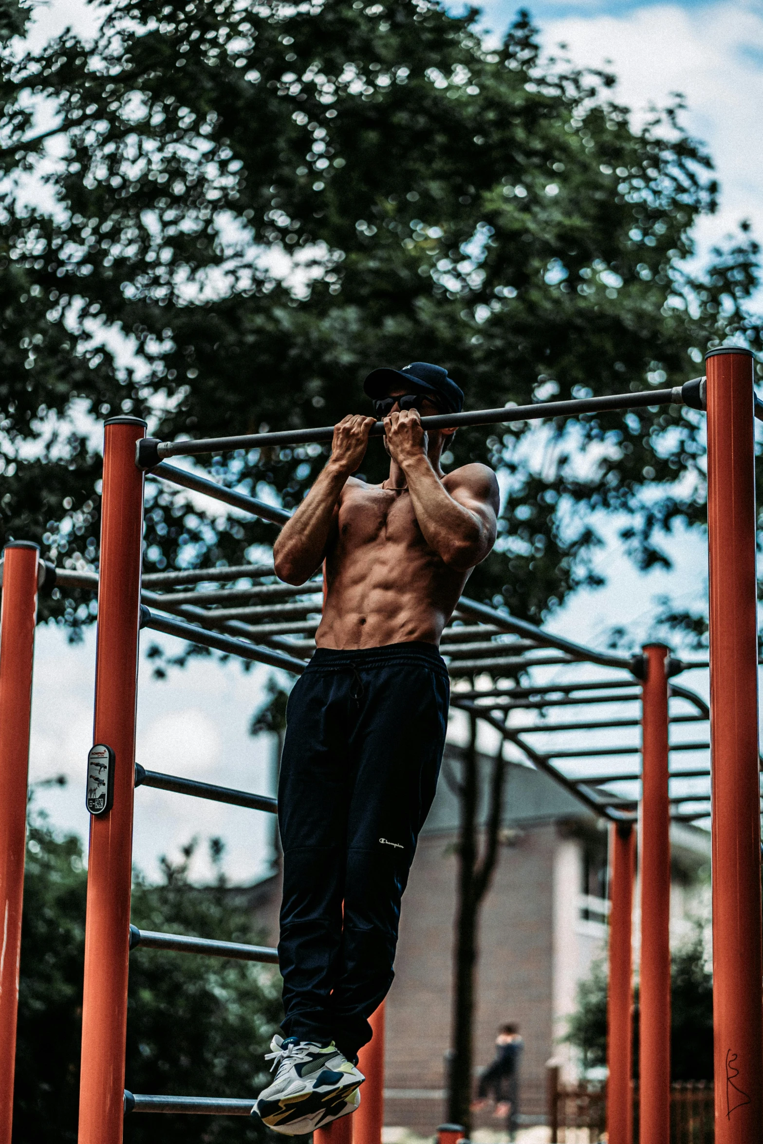 the man is jumping over bars on his skateboard