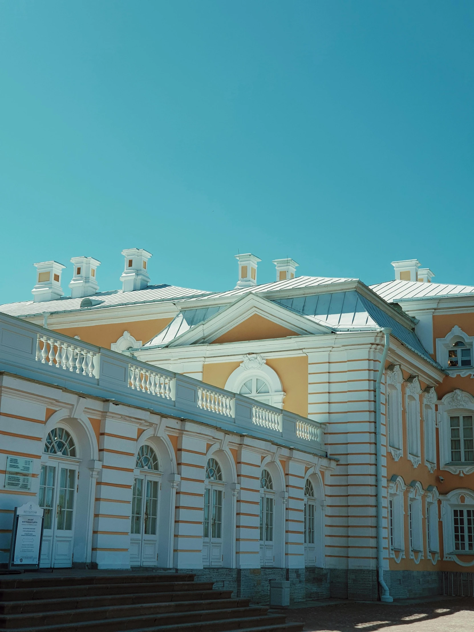 a building with a lot of windows and a flagpole