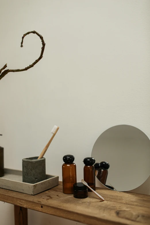 a wooden table with some bottles and a plant