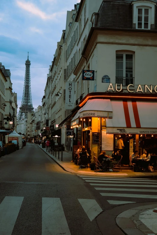 a street in a city with a few cars parked