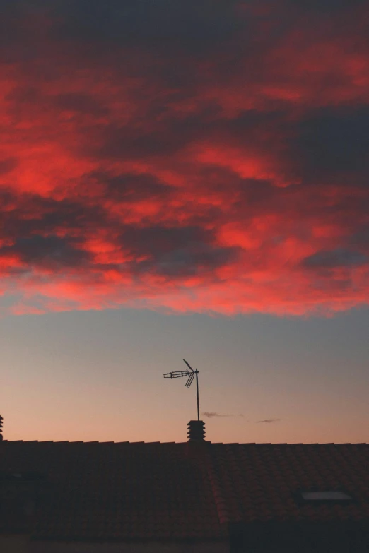 a sunset with an interesting sky and some red clouds