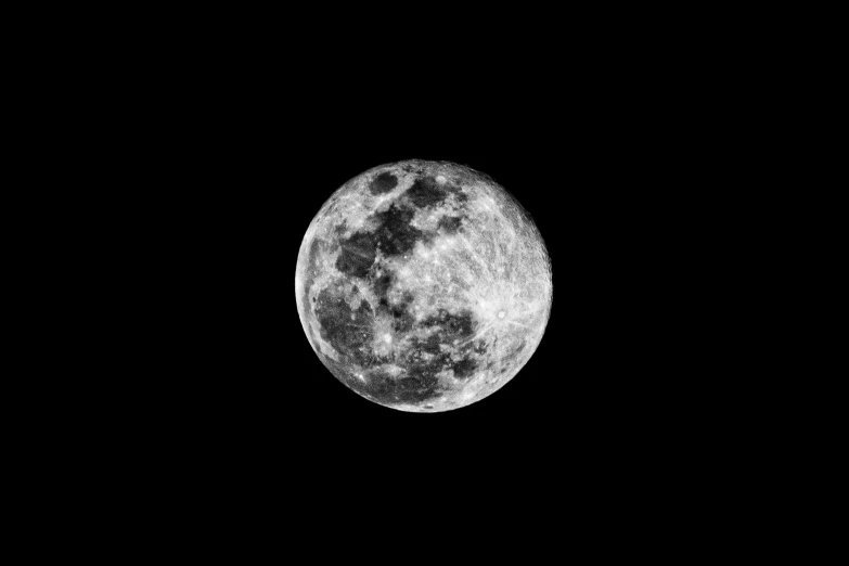 a black and white image of a full moon
