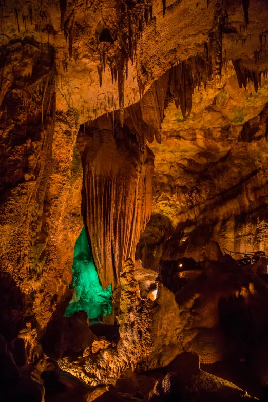 the inside of a cave with water and rock formations