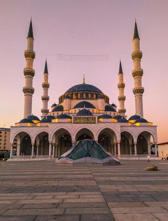 two blue and white domes are in the middle of the building