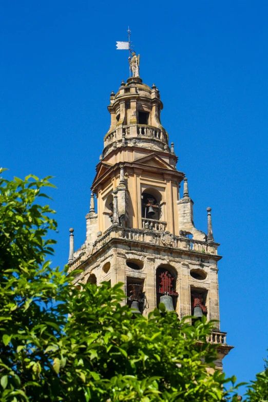 a tall clock tower is shown in front of the sky