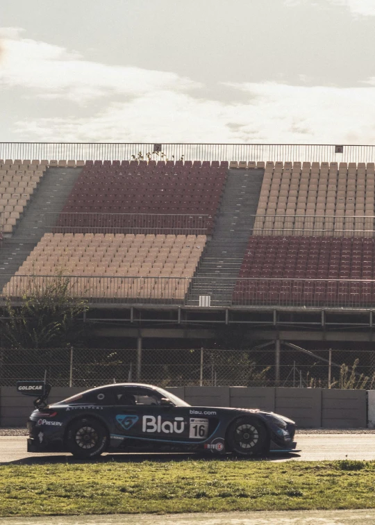 a race car on the track at a stadium