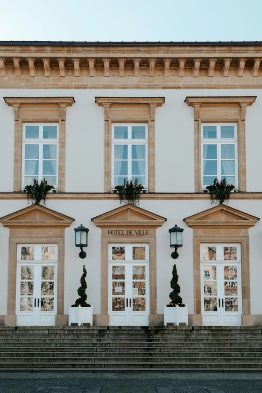 the building has many windows and doors with small windows