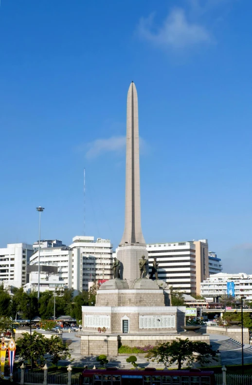 a tall monument in the middle of a park